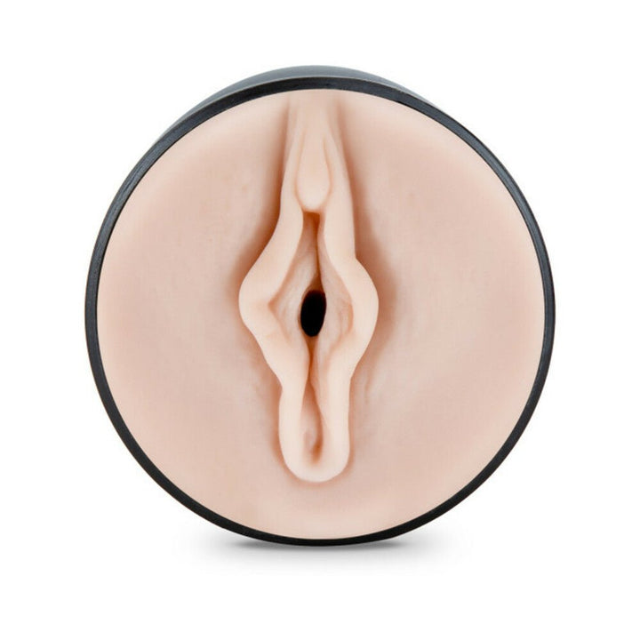 Top view of a vanilla-colored M for Men Pussy Pleasure Orbs textured male masturbator in a black circular case.