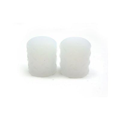 Pair of translucent white silicone nipple suckers with textured sides on a white background.