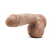 Realistic flesh-toned dildo with textured shaft, pronounced head, attached balls, and suction cup base for hands-free use.