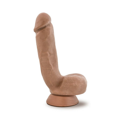Realistic brown dildo with suction cup base and attached textured balls, standing upright on white background.