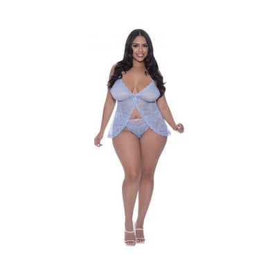Plus size model wearing periwinkle lace babydoll with split crotch panty and adjustable straps, paired with white heels.