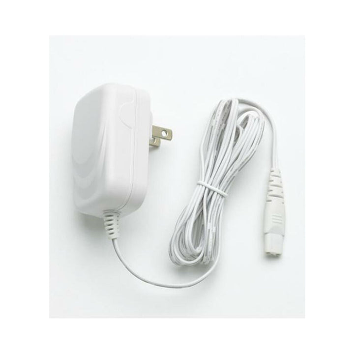 White Magic Wand Plus power adapter with attached long cable and plug on a white background