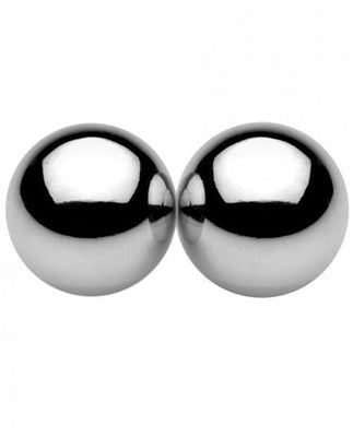 Two polished silver magnetic orbs placed side by side with a reflective surface.