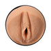 Close-up of a lifelike beige Ultraskyn stroker molded to resemble a realistic female anatomy detail.