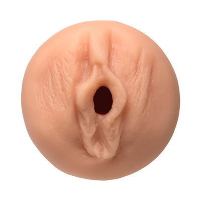 Close-up view of a flesh-toned realistic textured masturbator modeled after Dani Daniels.