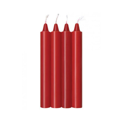 Four red sensual warm drip candles standing upright with unlit wicks against a white background.