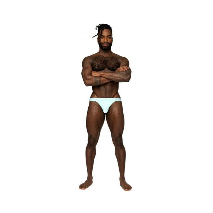 Male model wearing aqua blue Male Power Easy Breezy thong sleeve underwear standing with arms crossed on white background.