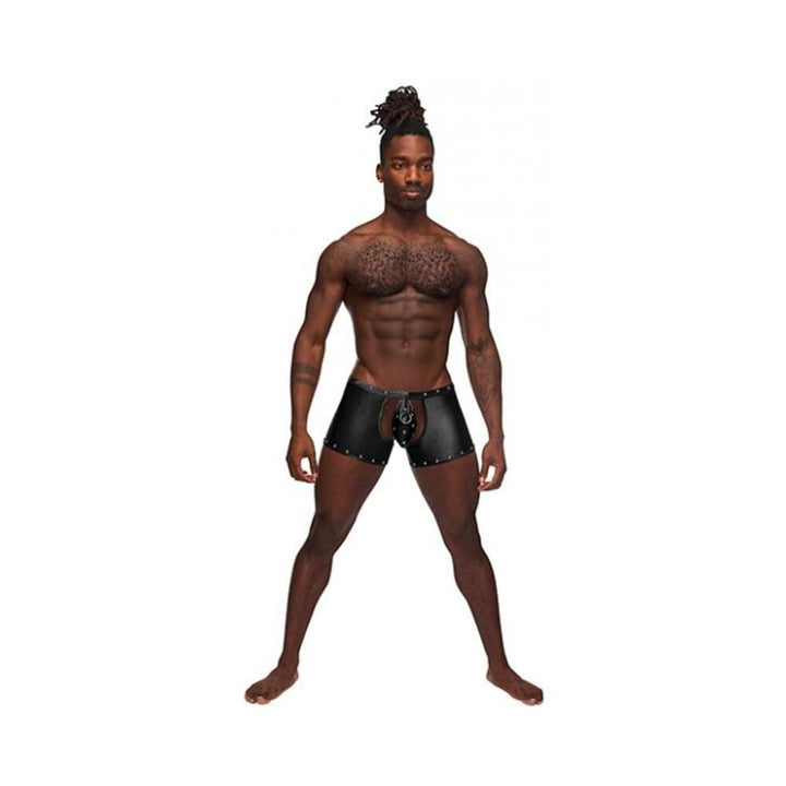 Male model wearing black nylon spandex tear-off cup thong shorts with studded detailing and lace-up front.