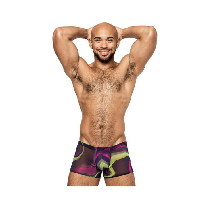 Smiling man wearing Male Power Galactic Mini Shorts with vibrant cosmic print and sheer micro mesh fabric.