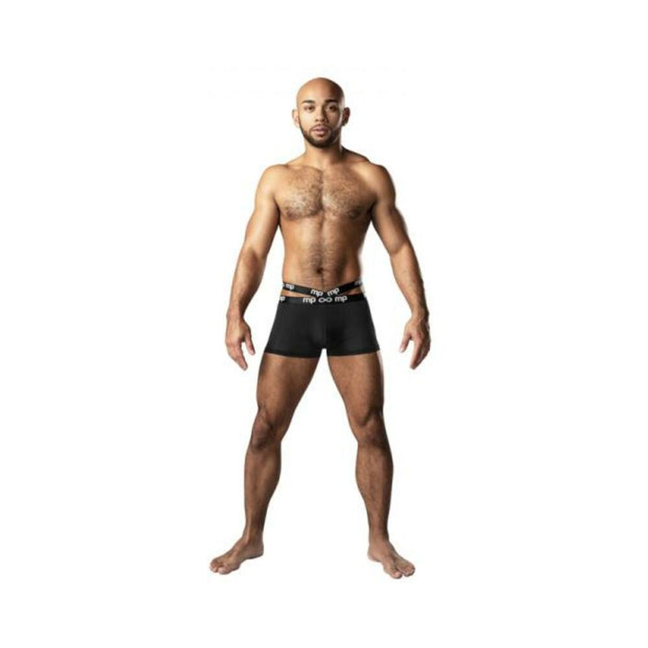 Man wearing black Male Power Infinite Comfort amplifying strappy pouch shorts with dual elastic waistbands on white background.