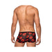 Back view of male wearing black sheer mini shorts with red lips print design.