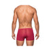 Back view of a man wearing seamless wine-colored mini shorts with a sheer finish and a low-rise waist.