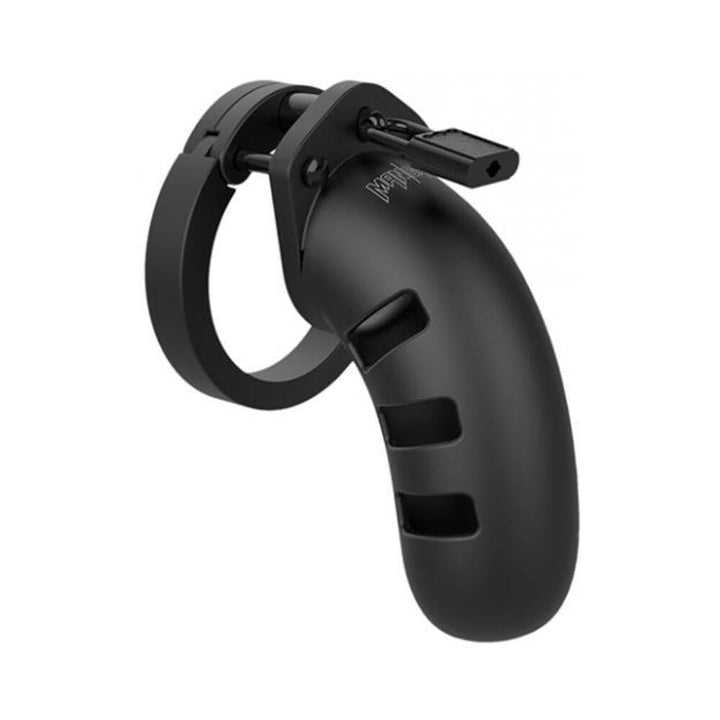 Black silicone Man Cage Model 17 chastity device with ventilation slots and a secure locking mechanism.