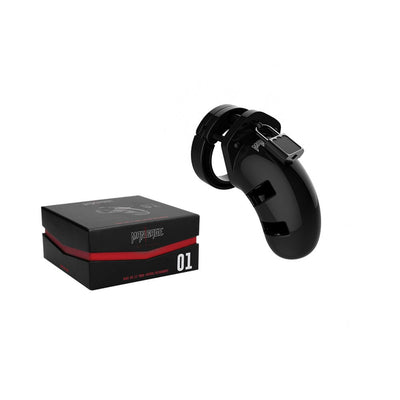 Black Mancage Model 01 3.5-inch polycarbonate chastity cage with lock next to its black and red packaging box.