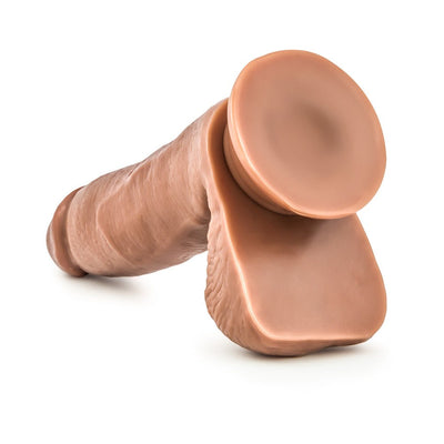 Realistic Latin skin tone dildo with suction cup base, detailed texture, and lifelike design on white background.
