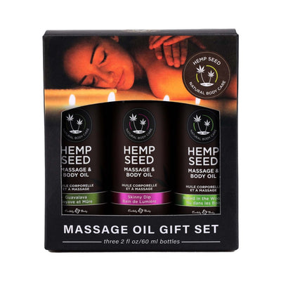 Earthly Body Hemp Seed Massage Oil Gift Set with three 2 oz bottles in Guavalava, Skinny Dip, and Naked in the Woods scents.