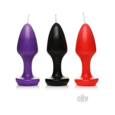 Set of three butt plug shaped candles in purple, black, and red with wicks for wax play.