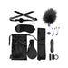 Merci The Vip Room BDSM set in black with satin blindfold, ball gag, feather tickler, nipple clamps, vibrator, c-ring, paddle, straps, and storage bag.