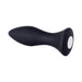 Compact black silicone butt plug with tapered tip and white power button on base, designed for comfortable, rechargeable use.