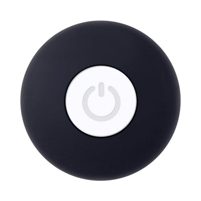Top view of a black rechargeable mini butt plug with a central white power button.