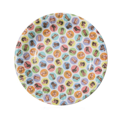 Round party plate with colorful circles featuring playful adult-themed illustrations in various skin tones.