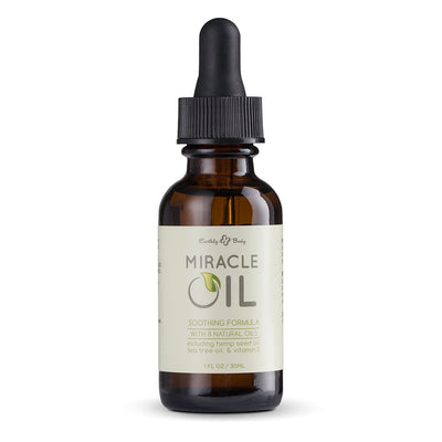 1 oz amber glass bottle of Earthly Body Miracle Oil with dropper cap and natural oils label