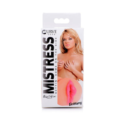 Packaging of Curve Novelties Mistress BioSkin Brittany featuring a blonde model and product image on a white background.