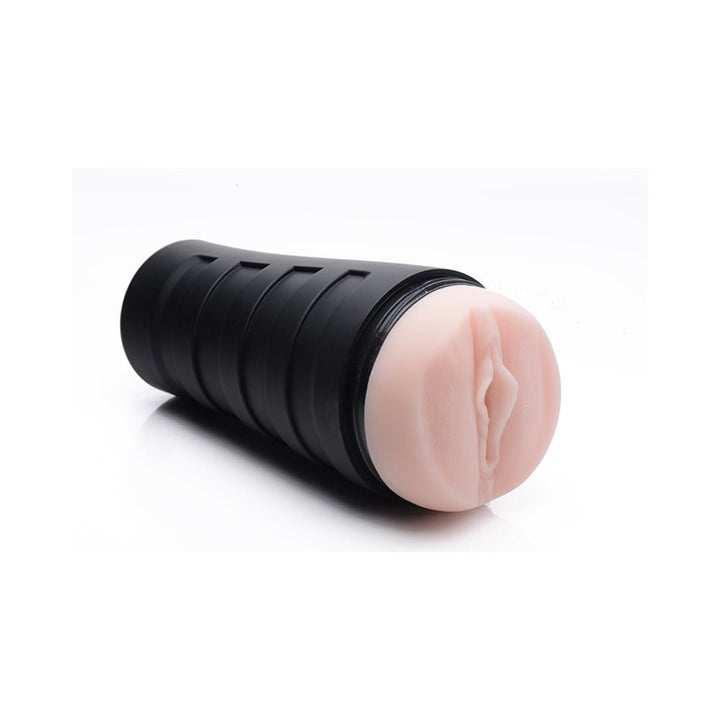 Ivory-colored deluxe stroker with textured sleeve and black ergonomic outer case on white background.