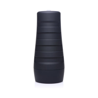 Black textured cylindrical male stroker with a ribbed exterior for grip on a white background.