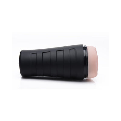 Ivory-colored deluxe stroker with textured sleeve and black ergonomic outer case on white background.