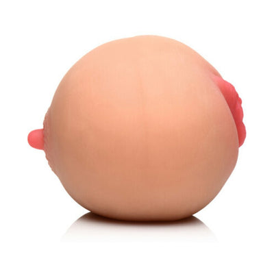 Medium-sized realistic breast and pussy masturbator made from soft skin-toned material with detailed nipples.