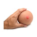 Hand holding a medium-sized realistic breast masturbator with a detailed nipple on a white background.