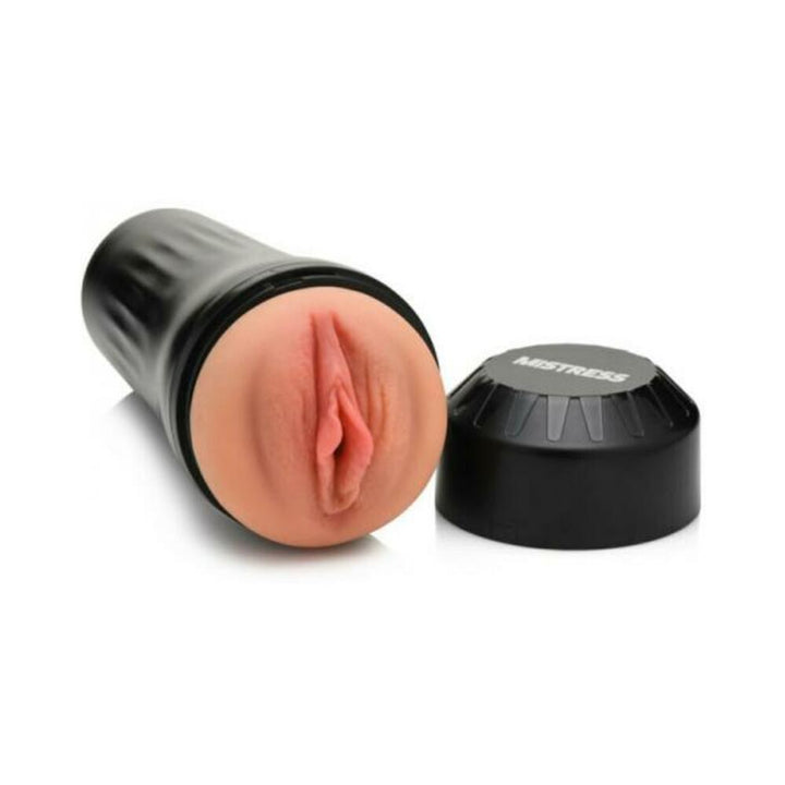 Mistress Vibrating Pussy Masturbator in black case with realistic soft silicone sleeve and removable cap on white background.