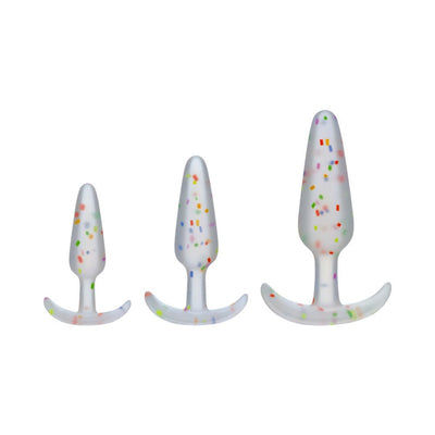 Three sizes of translucent silicone anal plugs with colorful confetti-like speckles, arranged side by side on white background.