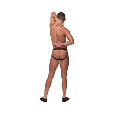 Rear view of a man wearing a black fishnet cock ring jockstrap with elastic waistband and leg straps.