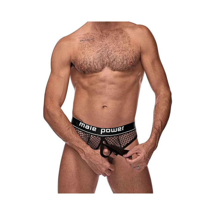Male model wearing black mesh cock ring thong with "male power" waistband, showing front elastic ring detail.