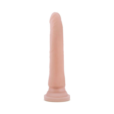 Slim realistic dildo in natural skin tone with suction cup base for hands-free use.