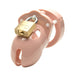 Pink male chastity device with brass lock and vented design for comfort and hygiene.