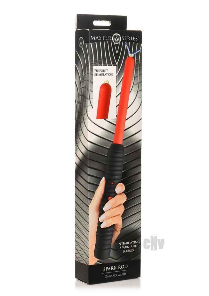 Packaging of the Ms Spark Rod Zapping Wand showing a hand holding the black ribbed handle with an orange shaft emitting a spark.
