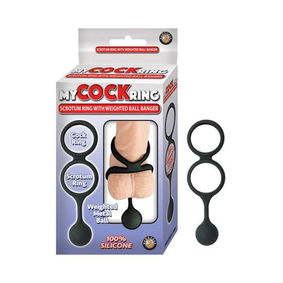 Black silicone dual cock and scrotum ring with weighted ball, shown with packaging and usage illustration.