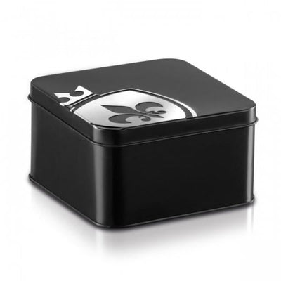 Black square metal storage case with silver fleur-de-lis emblem on the lid for discreet adult product packaging.