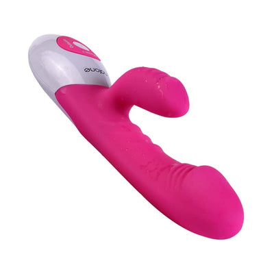 Pink dual-stimulation vibrator with textured silicone surface and white control panel with buttons.