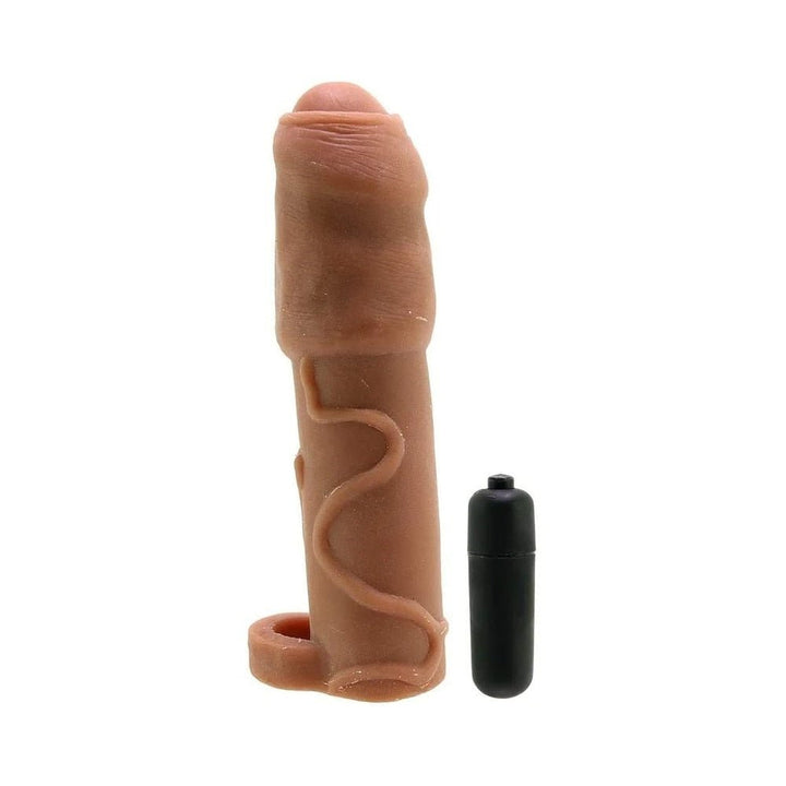 Brown uncircumcised realskin penis extender sleeve with removable black bullet vibrator on white background.