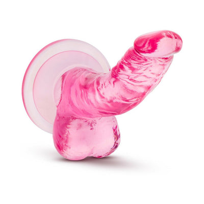 Pink translucent mini dildo with suction cup base and realistic curved design for targeted stimulation.