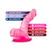 Pink mini dildo with suction cup base, highlighting body-safe, fragrance-free, latex-free, soft feel, G-spot stimulation, and harness compatibility.