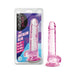 7-inch translucent pink crystalline dildo with suction cup base shown next to its retail packaging.