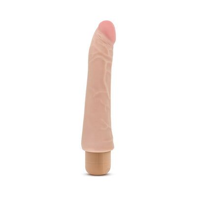 Realistic flesh-toned curved vibrator with textured surface and rounded tip on beige base against white background