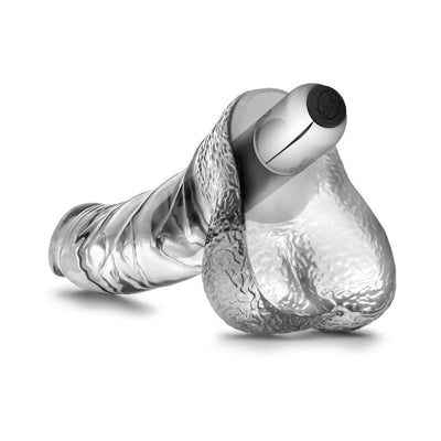 Clear textured realistic dildo with removable silver vibrating bullet inserted, displayed on white background.