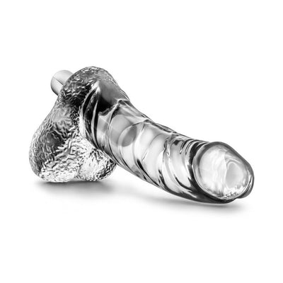Clear realistic vibrating dildo with textured base and removable waterproof bullet on white background.