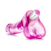 Pink translucent realistic dildo with textured surface and removable white and pink vibrating bullet on a white background.